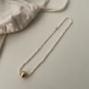 IMG_2008.HEIC Asymmetric Double-Strand Seed Pearl Bracelet with Gold Orb in 18K Gold‑Plated Sterling Silver